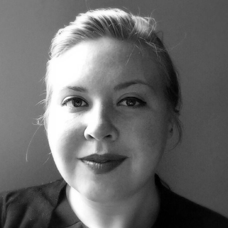 Black and white photo of a light-skinned woman.